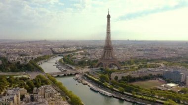 PARIS, FRANCE - MAY, 2019: Aerial drone view of Eiffel tower and Seine river in historical city centre from above.
