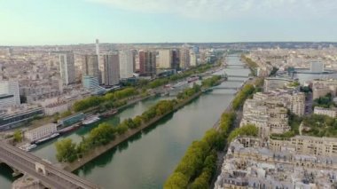 PARIS, FRANCE - MAY, 2019: Aerial drone view of the modern architecture district on Seine riverside in city centre.