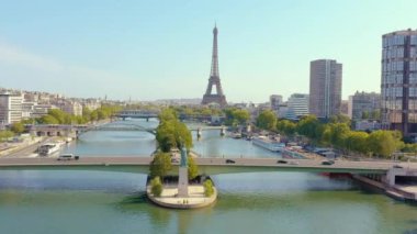 PARIS, FRANCE - MAY, 2019: Aerial drone view of Eiffel tower and Seine river in historical city centre from above.