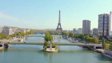 PARIS, FRANCE - MAY, 2019: Aerial drone view of Eiffel tower and Seine river in historical city centre from above.