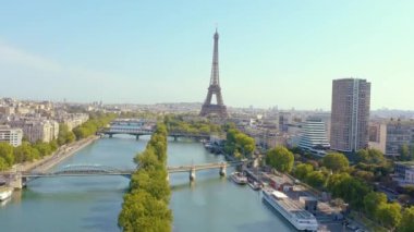 PARIS, FRANCE - MAY, 2019: Aerial drone view of Eiffel tower and Seine river in historical city centre from above.