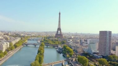 PARIS, FRANCE - MAY, 2019: Aerial drone view of Eiffel tower and Seine river in historical city centre from above.