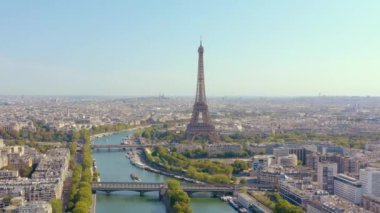 PARIS, FRANCE - MAY, 2019: Aerial drone view of Eiffel tower and Seine river in historical city centre from above.