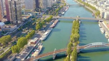 PARIS, FRANCE - MAY, 2019: Aerial drone view of the Seine riverside with bridges.