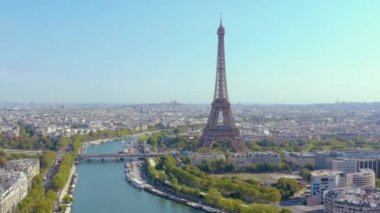 PARIS, FRANCE - MAY, 2019: Aerial drone view of Eiffel tower and Seine river in historical city centre from above.