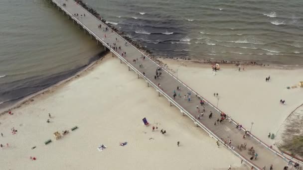 PALANGA, LITHUANIA - JULY, 2019: Aerial panorama view of the bridge and sandy beach of Palanga. — Stok video