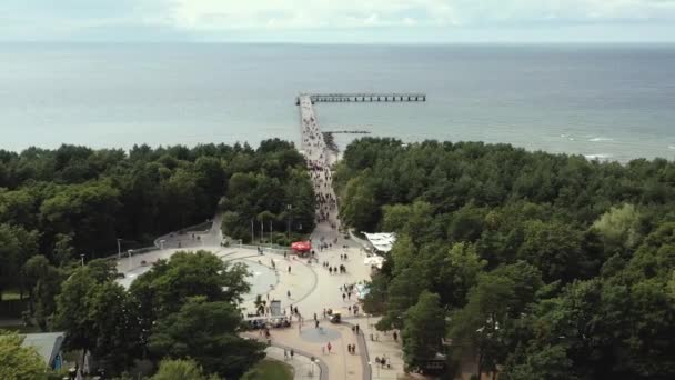 PALANGA, LITHUANIA - JULY, 2019: Aerial panorama view of the most popular street and bridge of Palanga with sea views. — Stockvideo