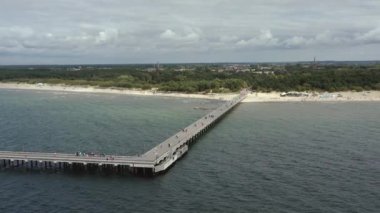 PALANGA, LITHUANIA - JULY, 2019: Aerial drone view of the famous pier in Palanga and panorama of the Baltic coast.