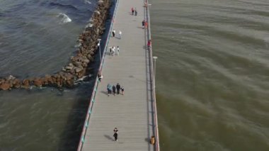 PALANGA, LITHUANIA - JULY, 2019: Aerial panorama view of people walking on the bridge in Palanga.