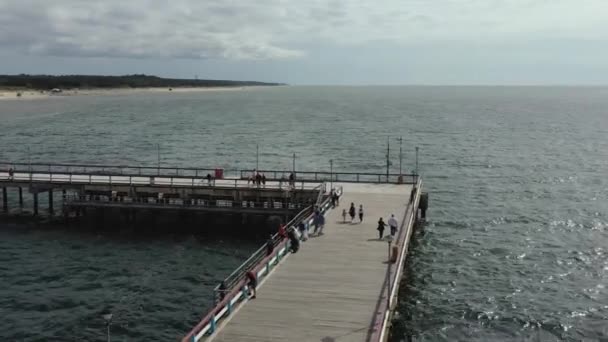 PALANGA, LITHUANIA - JULY, 2019: Aerial panorama view of the famous pier of the Baltic coast in Palanga and sea view. — Stock video