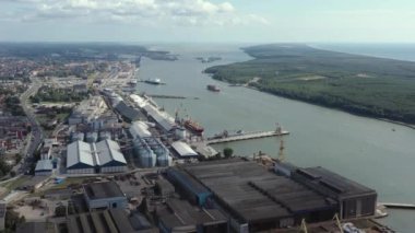 KLAIPEDA, LITHUANIA - JULY, 2019: Aerial panorama view of the port of Klaipeda and seascape of Baltic sea.