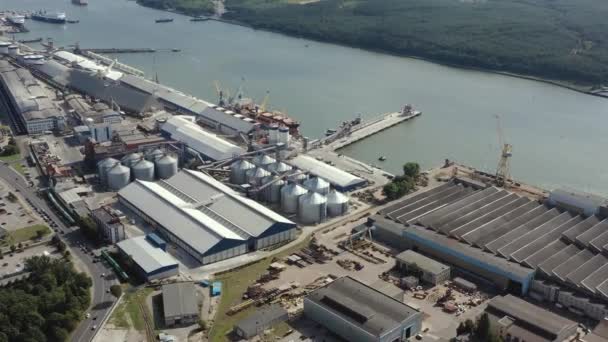 KLAIPEDA, LITHUANIA - JULY, 2019: Aerial panorama view of the port of Klaipeda, wharf, ship, hangars and cargo terminal. — стокове відео