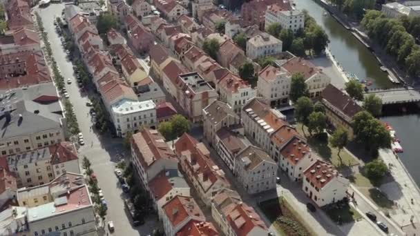 KLAIPEDA, LITHUANIA - JULY, 2019: Aerial panorama view of the old city centre of Klaipeda with Dane river shore. — Stock video