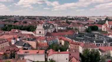 VILNIUS, LITHUANIA - JULY, 2019: Aerial view of the church of St. Spirit and top view of the old city centre of Vilnius.