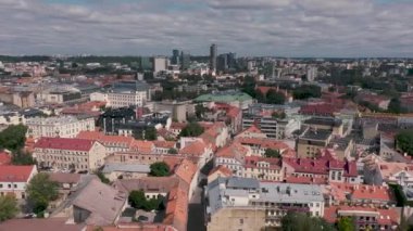 VILNIUS, LITHUANIA - JULY, 2019: Aerial view of the contrast architecture old city and modern metropolis of Vilnius.