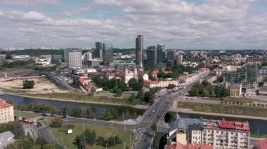 VILNIUS, LITHUANIA - JULY, 2019: Aerial view of the bridge over the Neris river near new industrial area of the city.