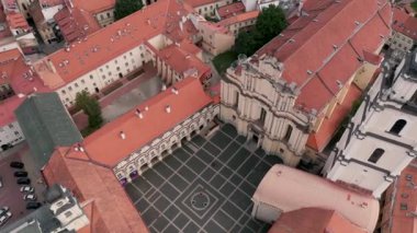 VILNIUS, LITHUANIA - JULY, 2019: Aerial view of the Bell tower of St. Johns church and courtyard of Vilnius University.