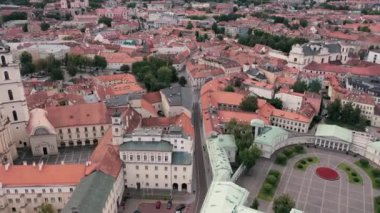 VILNIUS, LITHUANIA - JULY, 2019: Aerial view of the roofs of the old city centre and courtyard presidential residence.