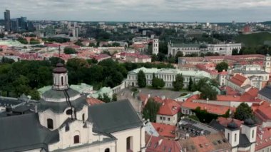 VILNIUS, LITHUANIA - JULY, 2019: Aerial view of the roof, dome of St. Spirits church and beauty of the old city centre.