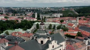 VILNIUS, LITHUANIA - JULY, 2019: Aerial view of the roof, dome of St. Spirits church and beauty of the old city centre.
