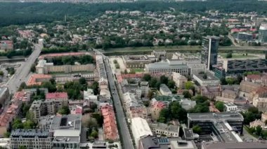 VILNIUS, LITHUANIA - JULY, 2019: Aerial panorama view of the roofs of houses and Vilnius cityscapes on a summer day.
