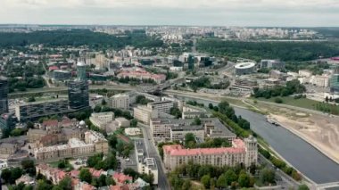 VILNIUS, LITHUANIA - JULY, 2019: Aerial panorama view of the roofs of houses and Vilnius cityscapes on a summer day.
