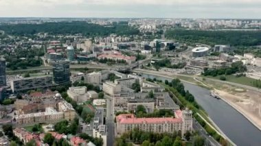 VILNIUS, LITHUANIA - JULY, 2019: Aerial panorama view of the roofs of houses and Vilnius cityscapes on a summer day.