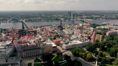 RIGA, LATVIA - MAY, 2019: Aerial top view of the old city centre of Riga, Daugava river, city park and Brivibas square.