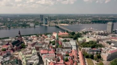 RIGA, LATVIA - MAY, 2019: Aerial panorama view of the beautiful Rigas old city and Vansu bridge over the Daugava river.