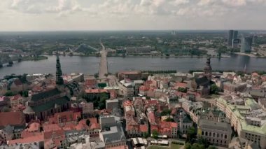 RIGA, LATVIA - MAY, 2019: Aerial panorama view of the old city centre of Riga and stone bridge over the Daugava river.