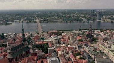 RIGA, LATVIA - MAY, 2019: Aerial panorama view of the old city centre of Riga and stone bridge over the Daugava river.