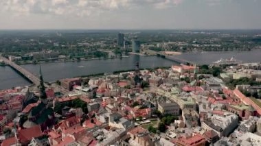 RIGA, LATVIA - MAY, 2019: Aerial top view of the old city centre of Riga, Vansu and stone bridge over the Daugava river.