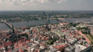 RIGA, LATVIA - MAY, 2019: Aerial top view of the old city centre of Riga, Vansu and stone bridge over the Daugava river.