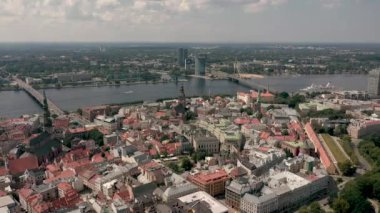 RIGA, LATVIA - MAY, 2019: Aerial top view of the old city centre of Riga, Vansu and stone bridge over the Daugava river.