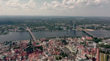 RIGA, LATVIA - MAY, 2019: Aerial top view of the old city centre of Riga, Vansu and stone bridge over the Daugava river.
