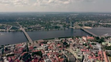 RIGA, LATVIA - MAY, 2019: Aerial top view of the old city centre of Riga, Vansu and stone bridge over the Daugava river.
