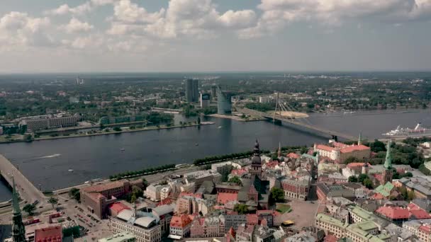 RIGA, LATVIA - MAY, 2019: Aerial panorama view of the old city centre of Riga and Vansu bridge over the Daugava river. — Wideo stockowe