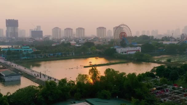 HANOI, VIETNAM - APRIL, 2020: Aerial panorama view of the ferris wheel and cityscape of one of the districts in Hanoi. — Stock Video