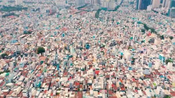 HOCHIMINH, VIETNAM - APRIL, 2020: Aerial panorama view on the roofs of houses and cityscape of Hochiminh. — Stock Video