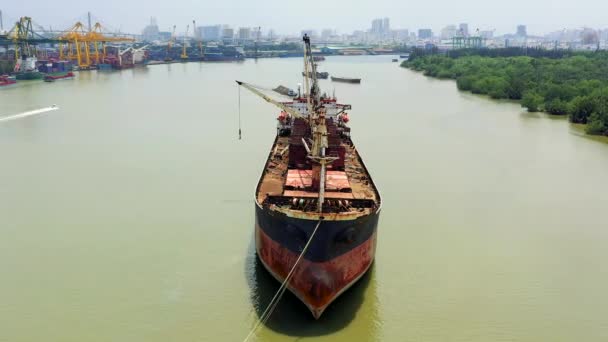 HOCHIMINH, VIETNAM - APRIL, 2020: Aerial panorama view of the tanker on Saigon river and cityscape of Hochiminh. — Stock Video