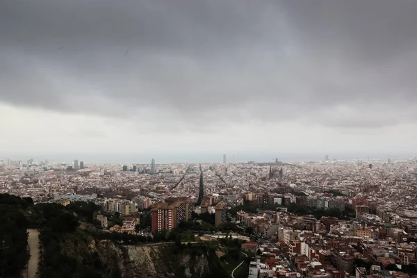 Cloudy view on Barcelona city from the mountain