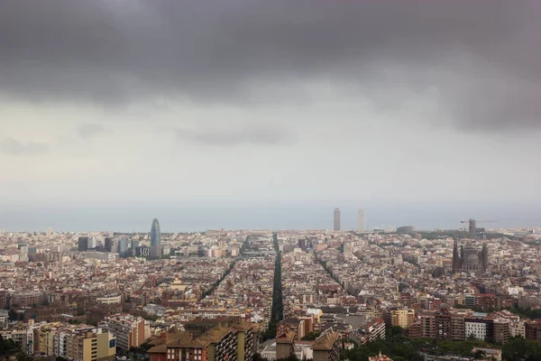 Cloudy view on Barcelona city from the mountain