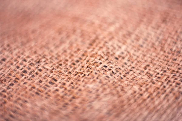 Arka plan kahverengi çuval bezi. Makro. Seçici odak