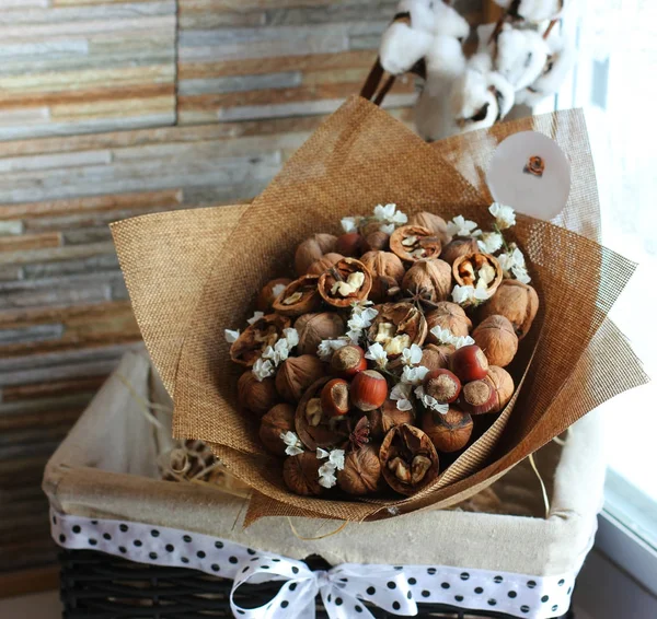 A bouquet of dried fruits, walnuts, acorns, hazelnuts, cinnamon,