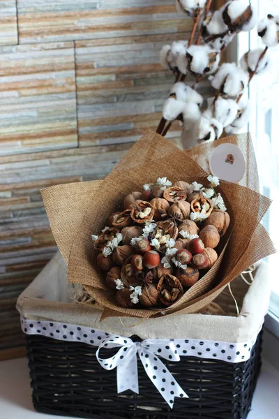 A bouquet of dried fruits, walnuts, acorns, hazelnuts, cinnamon,