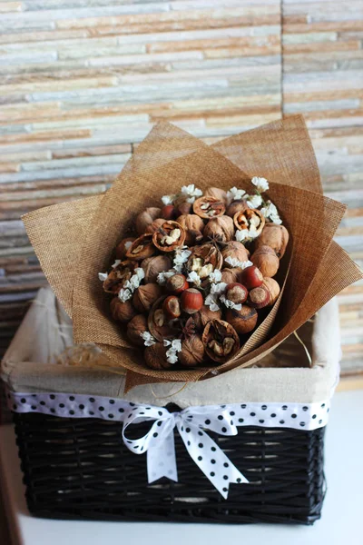 A bouquet of dried fruits, walnuts, acorns, hazelnuts, cinnamon,