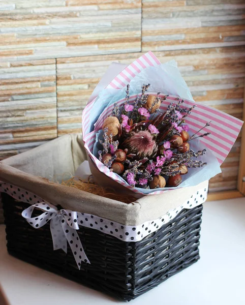 Bouquet of dried flowers of lavender, pink flowers and acorns. I