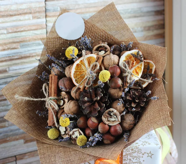 A bouquet of dried fruits, walnuts, acorns, hazelnuts, cinnamon,