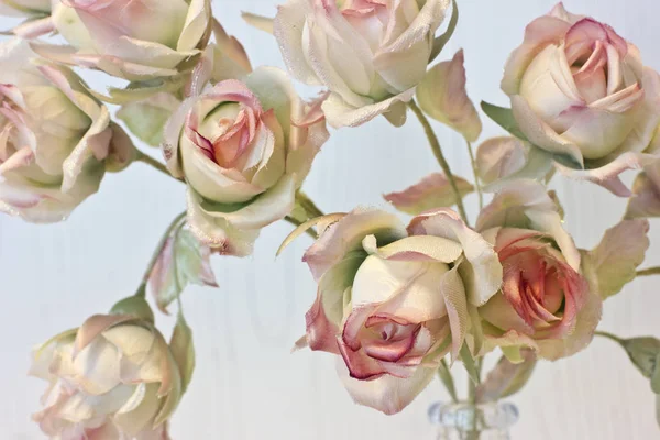 Large buds of pink and white roses. Artificial silk flowers in t — Stock Photo, Image