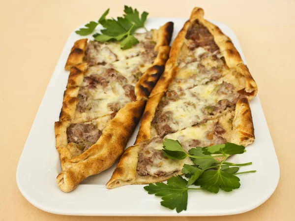 Turkish tortilla pita with pieces of meat, melted cheese and sli — Stock Photo, Image